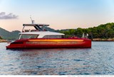Sunset reflection on the starboard hull